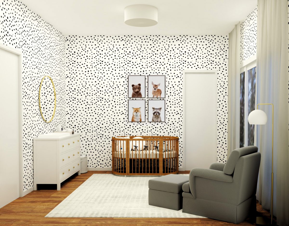 children's nursery with black polka dot wallpaper and pictures of animals hung on the walls
